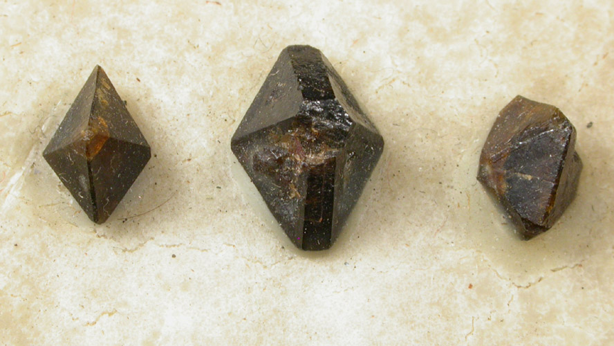 Three xenotime-(Y) crystals from 165th Street and Broadway, Manhattan 