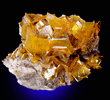 Wulfenite on Barite from Rowley Mine, 20 km northwest of Theba, Painted Rock Mountains, Maricopa County, Arizona