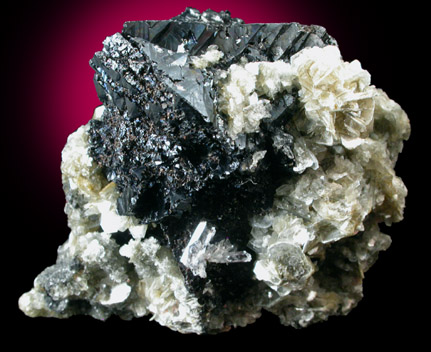 Cassiterite (twinned) on Muscovite from Xuebaoding Mountain, Pingwu, Sichuan, China