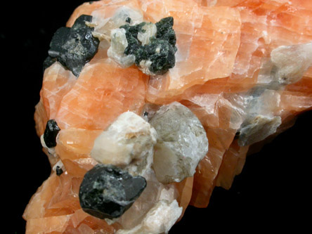 Diopside and Scapolite in orange Calcite from Route 6 road cut, Bear Mountain, Highland Falls, Orange County, New York