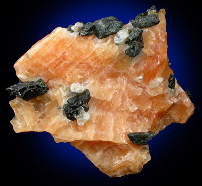 Diopside and Scapolite in orange Calcite from Route 6 road cut, Bear Mountain, Highland Falls, Orange County, New York