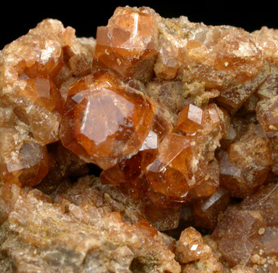 Grossular var. Essonite Garnet from Garnet exposure 175 m. SW of West Redding train station, Fairfield County, Connecticut