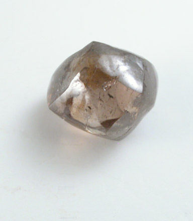 Diamond (0.86 carat brown dodecahedral crystal) from Oranjemund District, southern coastal Namib Desert, Namibia