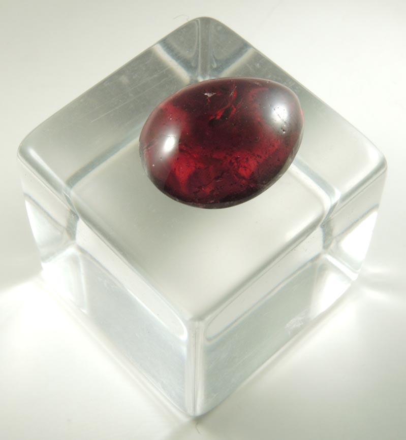 Almandine Garnet (polished cabochon) from 65th Street at Columbus Avenue, Manhattan Island, New York City, New York County, New York