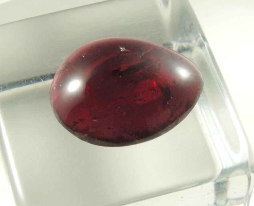 Almandine Garnet (polished cabochon) from 65th Street at Columbus Avenue, Manhattan Island, New York City, New York County, New York