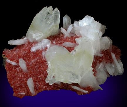 Apophyllite and Stilbite-Ca on red Heulandite from Mirzapur, Uttar Pradesh, India