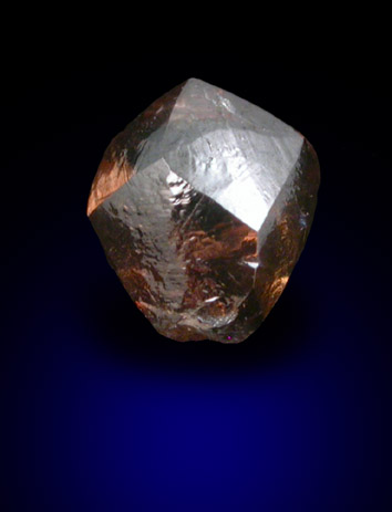 Diamond (0.63 carat red-brown dodecahedral crystal) from Oranjemund District, southern coastal Namib Desert, Namibia