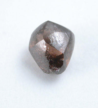 Diamond (0.63 carat red-brown dodecahedral crystal) from Oranjemund District, southern coastal Namib Desert, Namibia