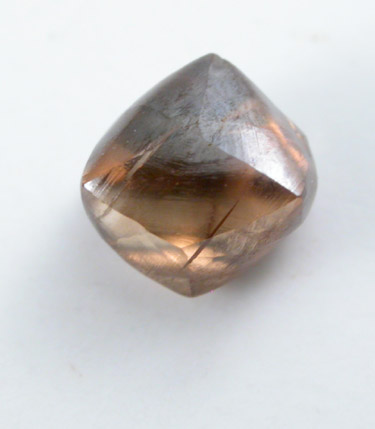 Diamond (0.61 carat orange-brown dodecahedral crystal) from Oranjemund District, southern coastal Namib Desert, Namibia