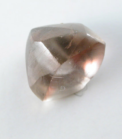 Diamond (1.13 carat pink flattened dodecahedral crystal) from Oranjemund District, southern coastal Namib Desert, Namibia