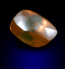Diamond (1.70 carat orange-brown elongated crystal) from Oranjemund District, southern coastal Namib Desert, Namibia