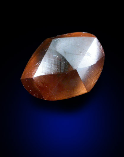 Diamond (1.49 carat orange-brown elongated dodecahedral crystal) from Oranjemund District, southern coastal Namib Desert, Namibia