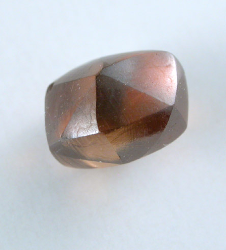 Diamond (1.49 carat orange-brown elongated dodecahedral crystal) from Oranjemund District, southern coastal Namib Desert, Namibia
