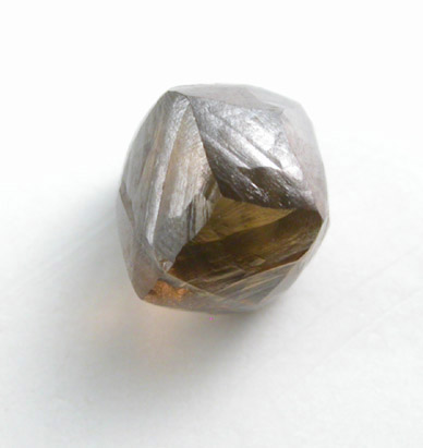 Diamond (0.82 carat red-brown dodecahedral crystal) from Oranjemund District, southern coastal Namib Desert, Namibia