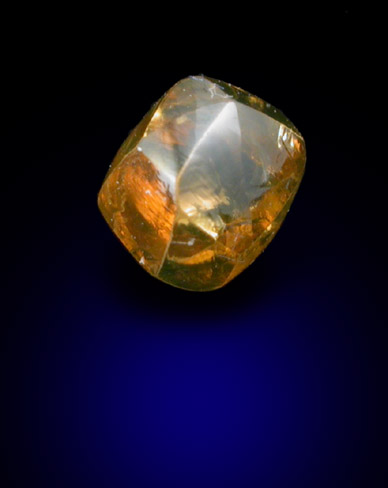 Diamond (0.46 carat golden-orange dodecahedral crystal) from Kimberley Mine, Northern Cape Province, South Africa