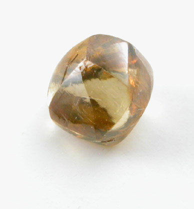 Diamond (0.46 carat golden-orange dodecahedral crystal) from Kimberley Mine, Northern Cape Province, South Africa