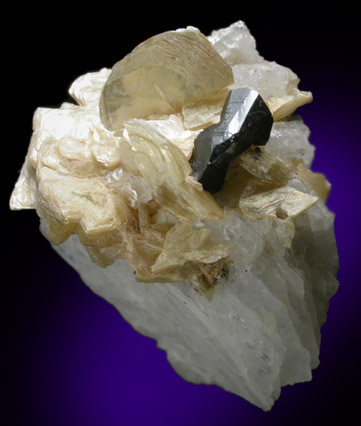 Cassiterite (twinned crystals) on Muscovite from Corrego do Urucum, Galileia, Minas Gerais, Brazil