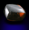 Diamond (1.47 carat red-brown elongated crystal) from Majhgawan Pipe, near Panna, Madhya Pradesh, India