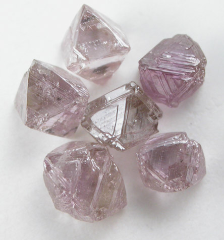 Diamond (six purple-pink octahedral crystals, 1.33 carats total) from Argyle Mine, Kimberley, Western Australia, Australia