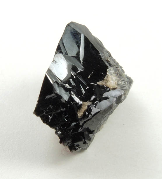 Cassiterite (twinned crystals) from Emmons Quarry, southeastern slope of Uncle Tom Mountain,  Greenwood, Oxford County, Maine