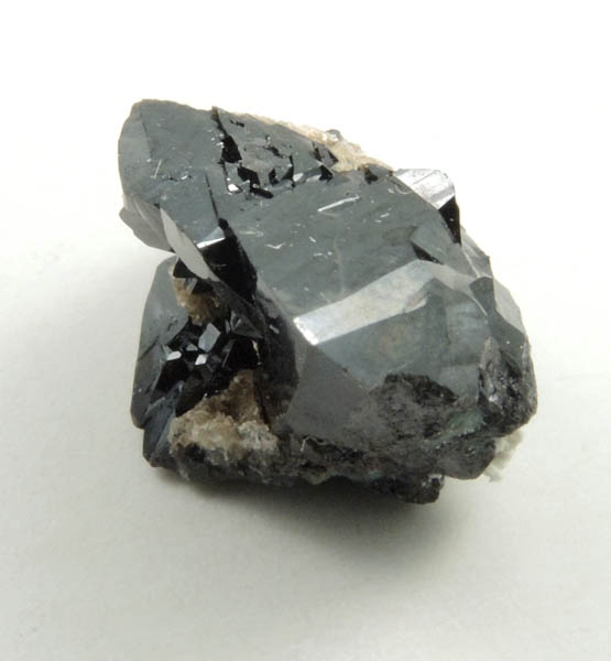 Cassiterite (twinned crystals) from Emmons Quarry, southeastern slope of Uncle Tom Mountain,  Greenwood, Oxford County, Maine