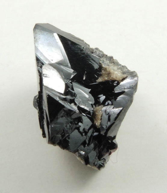 Cassiterite (twinned crystals) from Emmons Quarry, southeastern slope of Uncle Tom Mountain,  Greenwood, Oxford County, Maine