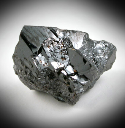 Cassiterite (twinned crystals) from Emmons Quarry, southeastern slope of Uncle Tom Mountain,  Greenwood, Oxford County, Maine