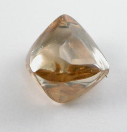Diamond (1.41 carat gem-grade orange-brown octahedral crystal) from Orapa Mine, south of the Makgadikgadi Pans, Botswana