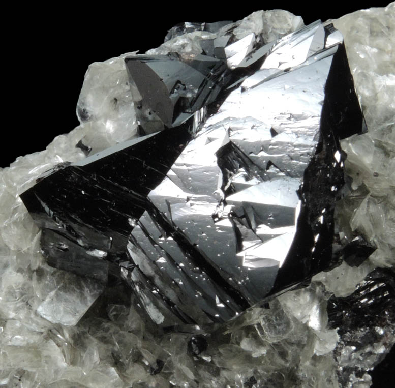 Cassiterite (twinned crystals) on Muscovite from Xuebaoding Mountain near Pingwu, Sichuan Province, China