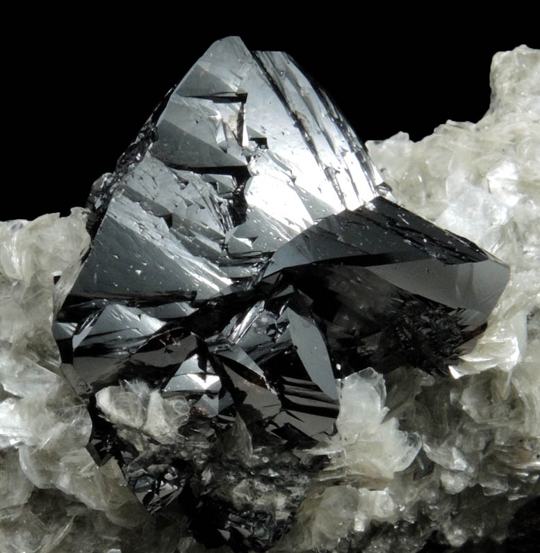 Cassiterite (twinned crystals) on Muscovite from Xuebaoding Mountain near Pingwu, Sichuan Province, China