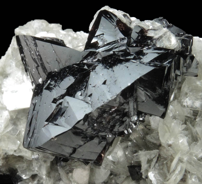 Cassiterite (twinned crystals) on Muscovite from Xuebaoding Mountain near Pingwu, Sichuan Province, China