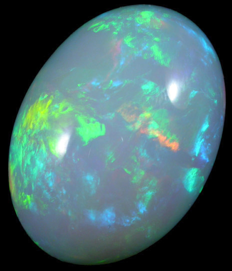 Opal var. Crystal Fire Opal (cabochon and rough) from 570 km north of Addis Ababa, Wello (Wollo), Delanta Plateau, Tigray, Ethiopia