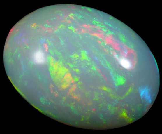Opal var. Crystal Fire Opal (cabochon and rough) from 570 km north of Addis Ababa, Wello (Wollo), Delanta Plateau, Tigray, Ethiopia