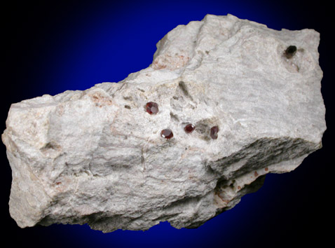 Spessartine Garnet on rhyolite from Ruby Mountain, Nathrop, Chaffee County, Colorado