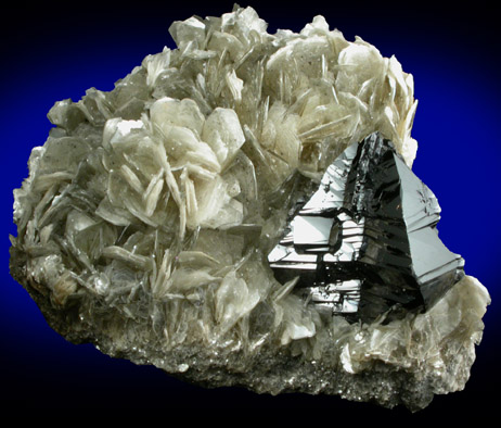 Cassiterite (twinned crystals) on Muscovite from Xuebaoding Mountain near Pingwu, Sichuan Province, China