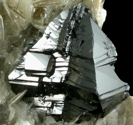 Cassiterite (twinned crystals) on Muscovite from Xuebaoding Mountain near Pingwu, Sichuan Province, China