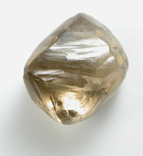 Diamond (2.25 carat brown octahedral crystal) from Damtshaa Mine, near Orapa, Botswana