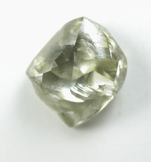 Diamond (0.97 carat green-gray flattened crystal) from Oranjemund District, southern coastal Namib Desert, Namibia