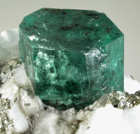 Beryl var. Emerald on Calcite with Pyrite from Muzo Mine, Vasquez-Yacop District, Boyac Department, Colombia