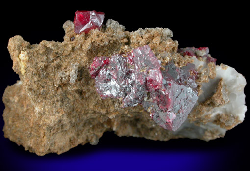 Cinnabar (penetration twins) on Calcite-Quartz matrix from Red Bird Mine, Antelope Springs District, 24 km east of Lovelock, Pershing County, Nevada