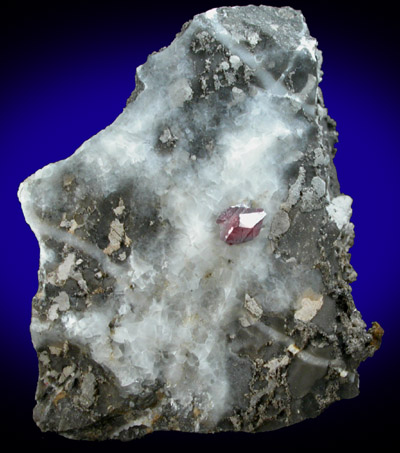 Cinnabar (penetration twin) on Calcite from Red Bird Mine, Antelope Springs District, 24 km east of Lovelock, Pershing County, Nevada