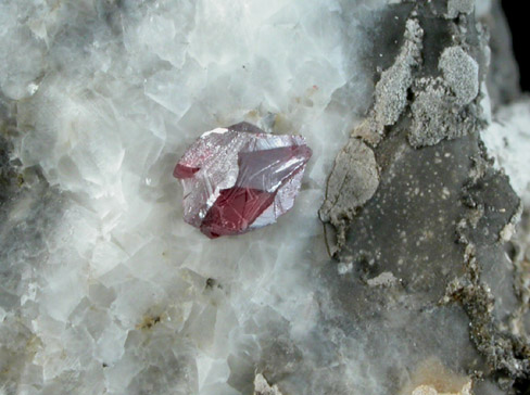 Cinnabar (penetration twin) on Calcite from Red Bird Mine, Antelope Springs District, 24 km east of Lovelock, Pershing County, Nevada