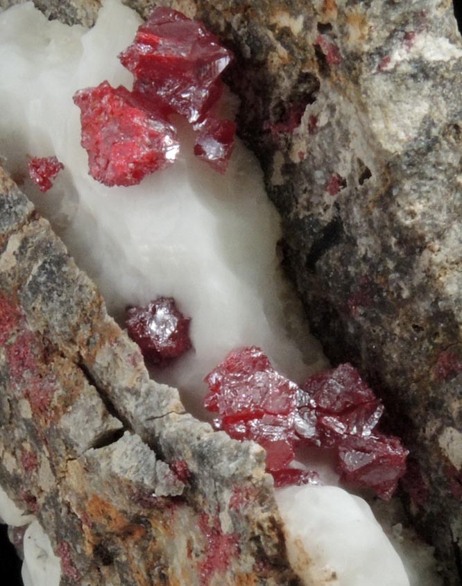 Cinnabar (penetration twins) in Calcite from Red Bird Mine, Antelope Springs District, 24 km east of Lovelock, Pershing County, Nevada