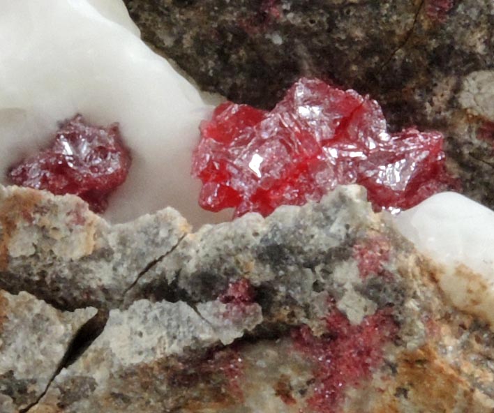 Cinnabar (penetration twins) in Calcite from Red Bird Mine, Antelope Springs District, 24 km east of Lovelock, Pershing County, Nevada