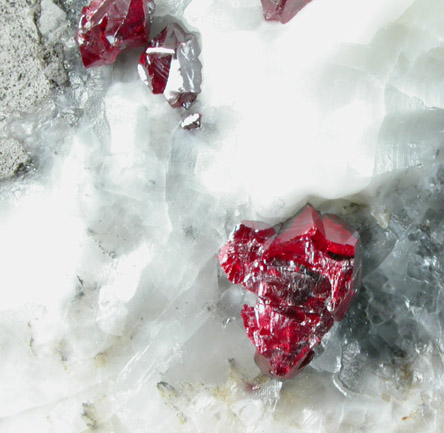 Cinnabar (penetration twins) on Calcite from Red Bird Mine, Antelope Springs District, 24 km east of Lovelock, Pershing County, Nevada