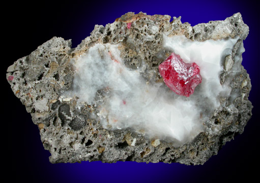 Cinnabar (penetration twin) on Calcite from Red Bird Mine, Antelope Springs District, 24 km east of Lovelock, Pershing County, Nevada