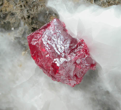 Cinnabar (penetration twin) on Calcite from Red Bird Mine, Antelope Springs District, 24 km east of Lovelock, Pershing County, Nevada