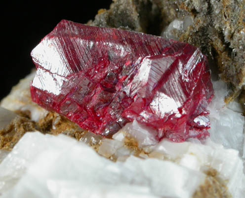 Cinnabar (penetration twin) on Calcite from Red Bird Mine, Antelope Springs District, 24 km east of Lovelock, Pershing County, Nevada