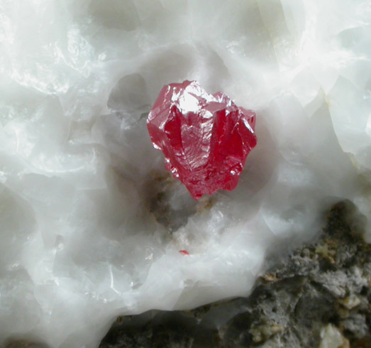 Cinnabar (penetration twins) on Calcite from Red Bird Mine, Antelope Springs District, 24 km east of Lovelock, Pershing County, Nevada