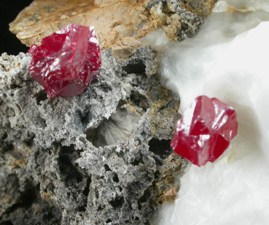 Cinnabar (penetration twins) on Calcite from Red Bird Mine, Antelope Springs District, 24 km east of Lovelock, Pershing County, Nevada